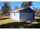 Detached two-car garage with single window at 9340 Sw 9Th Ter, Ocala, FL 34476