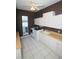Laundry room with modern washer, dryer, sink, and white cabinets for storage at 9340 Sw 9Th Ter, Ocala, FL 34476
