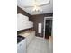 Well-lit laundry room featuring white cabinets, tile floors, and modern appliances at 9340 Sw 9Th Ter, Ocala, FL 34476