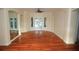 Open living area with beautiful hardwood floors, recessed lighting, and access to the outdoor living space at 9340 Sw 9Th Ter, Ocala, FL 34476