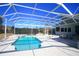 Inviting screened pool area with a spa and patio at 9340 Sw 9Th Ter, Ocala, FL 34476