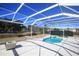 Sparkling pool and lanai with views of the lush, fenced backyard at 9340 Sw 9Th Ter, Ocala, FL 34476