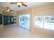 Bright sunroom has access to the lanai, windows with a view and tile flooring at 9340 Sw 9Th Ter, Ocala, FL 34476