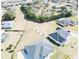 Aerial view of community, showing multiple single-Gathering homes and green spaces at 9645 Se 61St Ter, Belleview, FL 34420