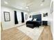 Main bedroom with dark wood accents, plush bedding, and large windows at 9645 Se 61St Ter, Belleview, FL 34420
