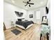 Stylish bedroom with a cozy atmosphere and wood flooring at 9645 Se 61St Ter, Belleview, FL 34420