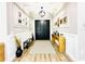 Bright and spacious entryway with hardwood floors and double doors at 9645 Se 61St Ter, Belleview, FL 34420