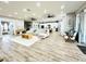 Spacious living room featuring hardwood floors and an open floorplan at 9645 Se 61St Ter, Belleview, FL 34420