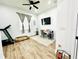 Home office space with a desk, treadmill, and window at 9645 Se 61St Ter, Belleview, FL 34420