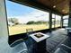 Peaceful screened porch with fire pit and backyard view at 9645 Se 61St Ter, Belleview, FL 34420