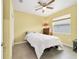 Cozy bedroom with a queen-size bed and large window at 9958 Sw 97Th Ln, Ocala, FL 34481