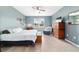 Bright bedroom featuring a king-size bed and built-in storage at 9958 Sw 97Th Ln, Ocala, FL 34481