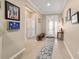 Bright entryway with tile flooring and access to other rooms at 9958 Sw 97Th Ln, Ocala, FL 34481