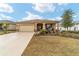 One-story home with attached garage and landscaped front yard at 9958 Sw 97Th Ln, Ocala, FL 34481