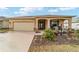 One-story house with front porch and two-car garage at 9958 Sw 97Th Ln, Ocala, FL 34481
