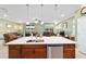 Open-concept kitchen with island and seating area at 9958 Sw 97Th Ln, Ocala, FL 34481