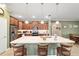 Modern kitchen with island and wood cabinets at 9958 Sw 97Th Ln, Ocala, FL 34481