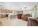 Open kitchen with island and stainless steel appliances at 9958 Sw 97Th Ln, Ocala, FL 34481