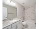 Clean bathroom with granite countertop and bathtub at 10120 Se 130Th St, Belleview, FL 34420