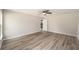 Spacious bedroom with hardwood floors and ceiling fan at 10120 Se 130Th St, Belleview, FL 34420