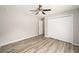 Spacious bedroom with double door closet and wood-look floors at 10120 Se 130Th St, Belleview, FL 34420