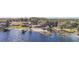 Aerial view of multiple lakefront homes and docks at 10455 Se 143Rd St, Summerfield, FL 34491