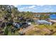 Large lot with house, multiple outbuildings, and lake access at 10455 Se 143Rd St, Summerfield, FL 34491