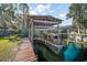 Private wooden boat lift with dock access at 10455 Se 143Rd St, Summerfield, FL 34491