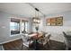 Bright dining room with lake view and hardwood floors at 10455 Se 143Rd St, Summerfield, FL 34491