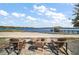 Relaxing fire pit area with lake views at 10455 Se 143Rd St, Summerfield, FL 34491