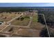 Aerial view of home on large lot with equestrian facilities at 11130 W Highway 326, Ocala, FL 34482