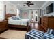 Spacious main bedroom with wood flooring and access to the outside at 11130 W Highway 326, Ocala, FL 34482