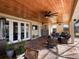 Relaxing outdoor patio with seating area and wood ceiling at 11130 W Highway 326, Ocala, FL 34482