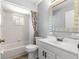 Clean bathroom with white vanity and tiled shower/tub at 11250 Sw 79Th Ter, Ocala, FL 34476