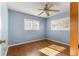 Spacious bedroom with wood flooring and ceiling fan at 11250 Sw 79Th Ter, Ocala, FL 34476