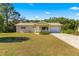 Ranch-style home with attached garage and porch at 11250 Sw 79Th Ter, Ocala, FL 34476