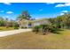 House exterior with driveway and landscaping at 11250 Sw 79Th Ter, Ocala, FL 34476