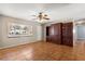 Spacious living room with built-in shelving and tile floors at 11250 Sw 79Th Ter, Ocala, FL 34476