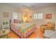 Cozy bedroom featuring a full-size bed and colorful decor at 1209 Se 17Th Ave, Ocala, FL 34471