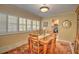 Charming dining room with a classic wooden table and built-in window seat at 1209 Se 17Th Ave, Ocala, FL 34471