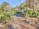 Brick pathway leads to charming home with lush landscaping at 1209 Se 17Th Ave, Ocala, FL 34471