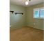 Bright bedroom with neutral walls, carpet, and double closets at 13981 Se 86Th Cir, Summerfield, FL 34491