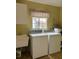 Laundry room with washer, dryer, and utility sink at 13981 Se 86Th Cir, Summerfield, FL 34491