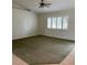 Spacious living room with wall-to-wall carpeting and large window at 13981 Se 86Th Cir, Summerfield, FL 34491