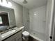 Bathroom with subway tile shower and granite vanity at 15010 Sw 61St Court Rd, Ocala, FL 34473