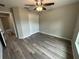 Bright bedroom featuring vinyl flooring and a double-door closet at 15010 Sw 61St Court Rd, Ocala, FL 34473