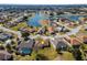 Aerial view showing home's location in a residential neighborhood near a lake at 17385 Se 110Th Ter, Summerfield, FL 34491