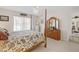 Bright bedroom with a post bed and ensuite access at 17385 Se 110Th Ter, Summerfield, FL 34491