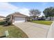 House exterior showcasing garage and driveway at 17385 Se 110Th Ter, Summerfield, FL 34491