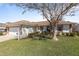 House exterior with a garage and landscaping at 17385 Se 110Th Ter, Summerfield, FL 34491